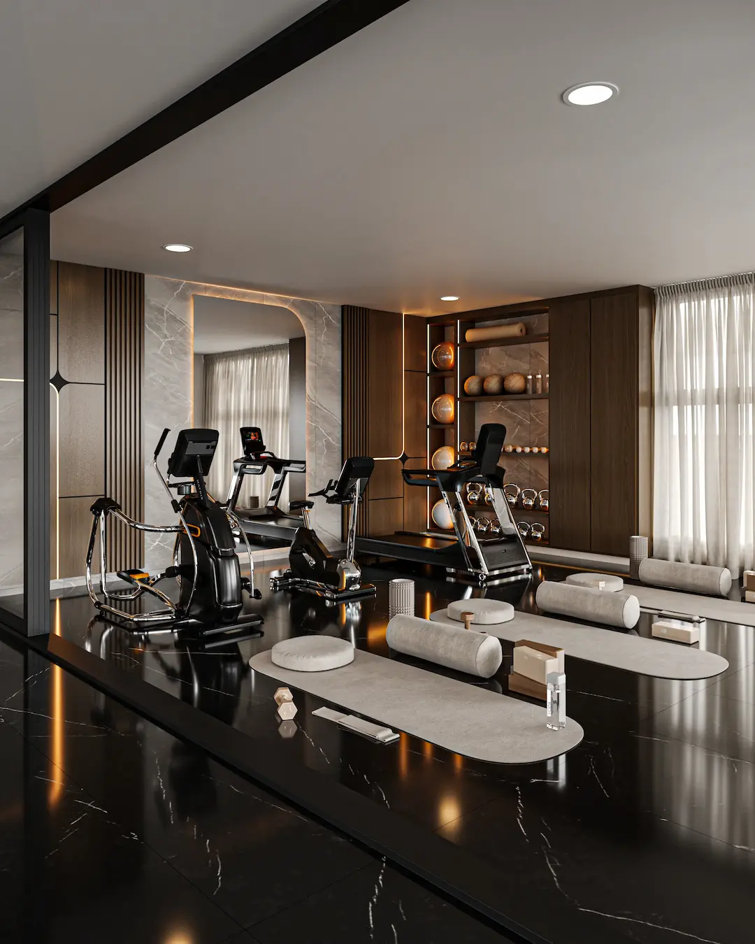 Gimnasio residencial con zona de yoga y acabados premium